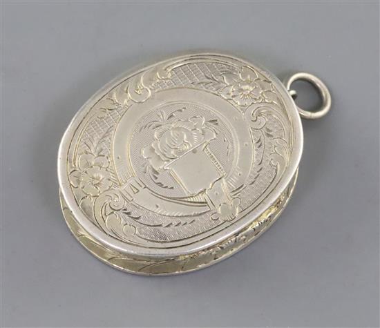 A Victorian engraved silver oval vinaigrette, by Aston & Son, gross 22 grams.